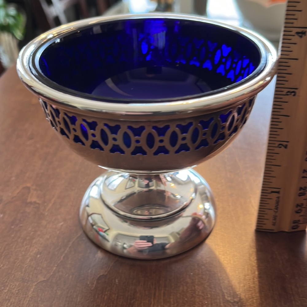 Beautiful silver pedestal bowl with colbalt blue glass insert.